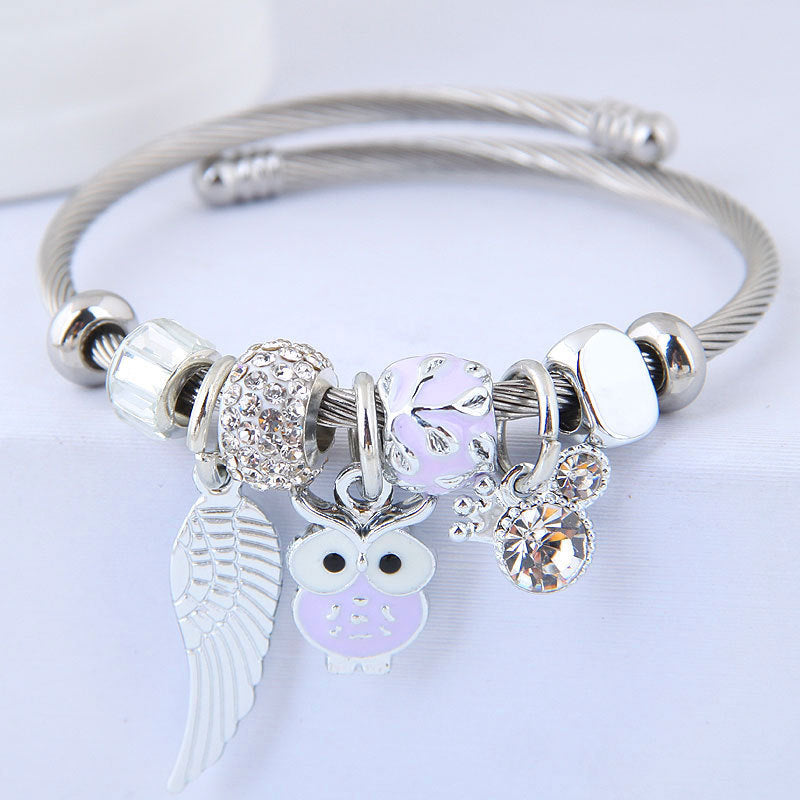 Bracciale in acciaio inossidabile con ciondolo a forma di gufo con perline e ali d'angelo