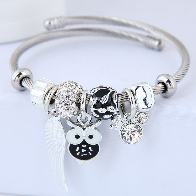 Bracciale in acciaio inossidabile con ciondolo a forma di gufo con perline e ali d'angelo