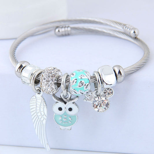 Bracciale in acciaio inossidabile con ciondolo a forma di gufo con perline e ali d'angelo